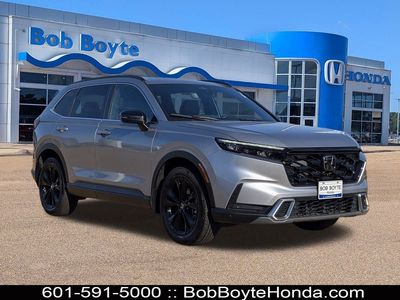 2023 Honda CR-V Hybrid Sport Touring in Lunar Silver Metallic — front three-quarter view