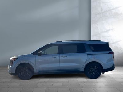 2026 Kia Carnival Hybrid — rear three-quarter view