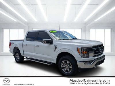 2023 Ford F-150 Lariat in White — front three-quarter view