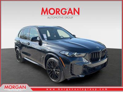 2024 BMW X5 M60i in Black — front three-quarter view