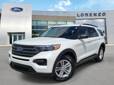 2023 Ford Explorer XLT in Star White Metallic Tri-Coat — front three-quarter view