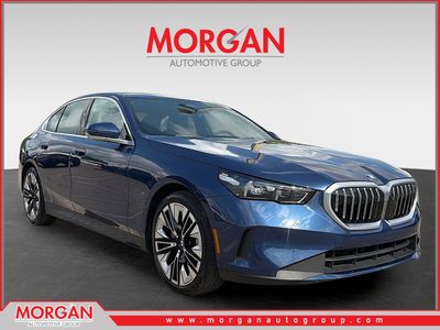 2026 BMW 5 Series 530i in Phytonic Blue Metallic — front three-quarter view