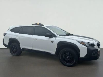 2025 Subaru Outback Wilderness in Crystal White Pearl — front three-quarter view