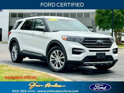 2023 Ford Explorer XLT GOLD CERTIFIED CO PILOT 360 2ND ROW BUCKETS in White Metallic — front three-quarter view