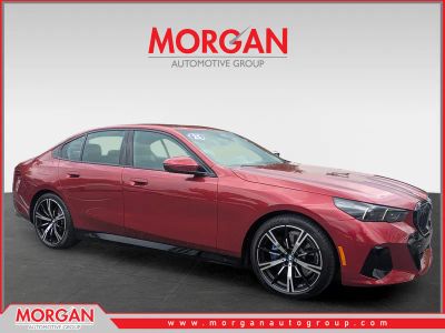 2025 BMW 5 Series 530i in Red — front three-quarter view