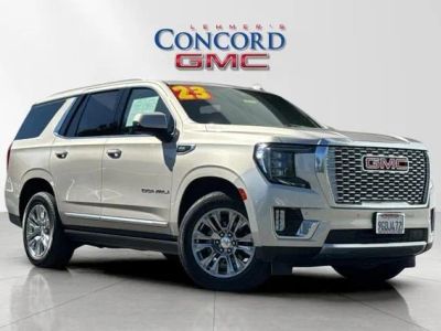 2023 GMC Yukon Denali in Pearl Beige Metallic — front three-quarter view