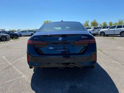 2027 BMW 5 Series — rear three-quarter view