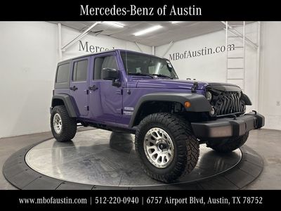 2017 Jeep Wrangler Unlimited Sport in Purple — front three-quarter view