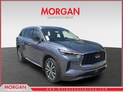2023 INFINITI QX60 SENSORY in Moonbow Blue — front three-quarter view