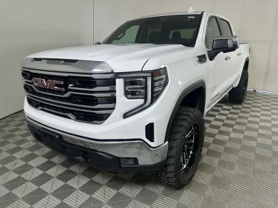 2025 GMC Sierra 1500 SLT in Summit White — front three-quarter view