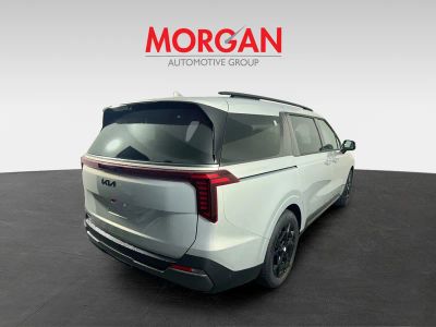 2026 Kia Carnival Hybrid — rear three-quarter view