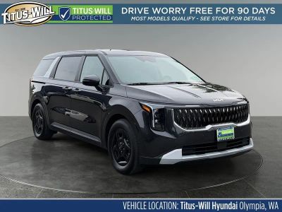 2026 Kia Carnival LXS in Panthera Metal — front three-quarter view