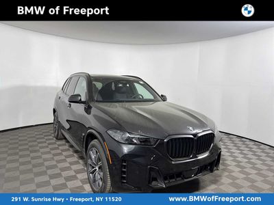 2026 BMW X5 xDrive40i xDrive40i in Black Sapphire Metallic — front three-quarter view