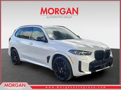 2026 BMW X5 M60i in Mineral White Metallic — front three-quarter view