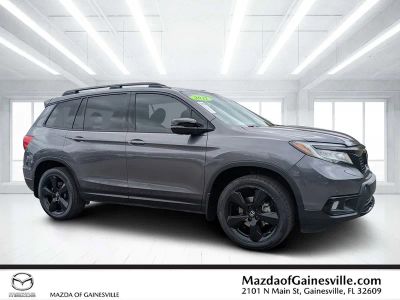 2021 Honda Passport Elite in Gray — front three-quarter view