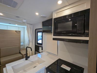 2026 Winnebago Thrive — rear three-quarter view