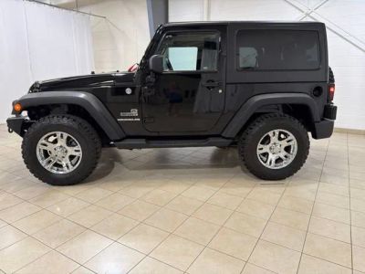 2014 Jeep Wrangler — rear three-quarter view