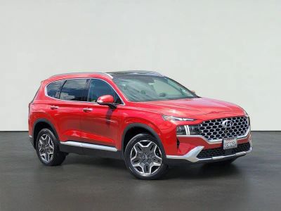 2023 Hyundai SANTA FE LIMITED in Calypso Red — front three-quarter view