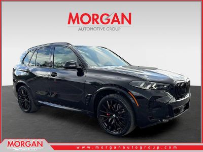 2026 BMW X5 xDrive40i in Black Sapphire Metallic — front three-quarter view