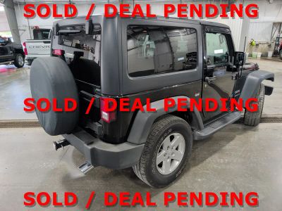 2014 Jeep Wrangler — rear three-quarter view