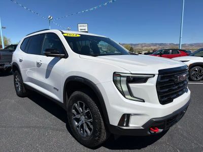 2024 GMC Acadia AT4 in White Frost Tricoat — front three-quarter view