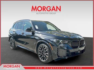 2026 BMW X5 xDrive50e in Black Sapphire Metallic — front three-quarter view