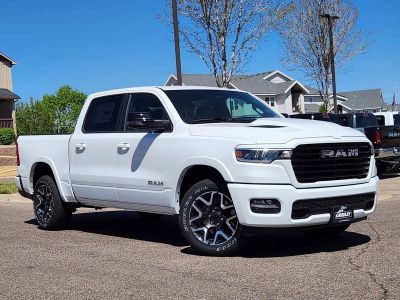 2026 RAM 1500 RAM 1500 LARAMIE CREW CAB 4X4 5'7' BOX in Bright White Clear-Coat Exterior Paint — front three-quarter view