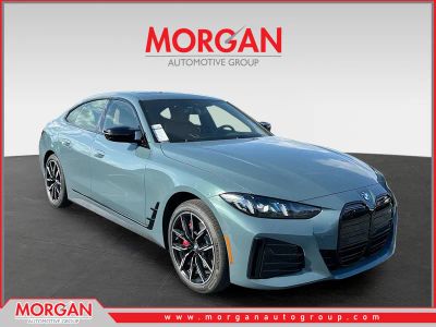 2026 BMW i4 M60 in Green — front three-quarter view