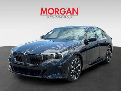 2027 BMW 5 Series — rear three-quarter view