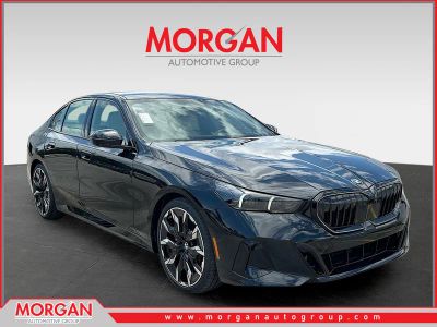 2027 BMW 5 Series 530i in Black Sapphire Metallic — front three-quarter view