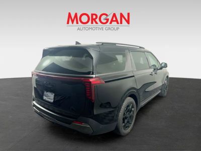 2026 Kia Carnival — rear three-quarter view