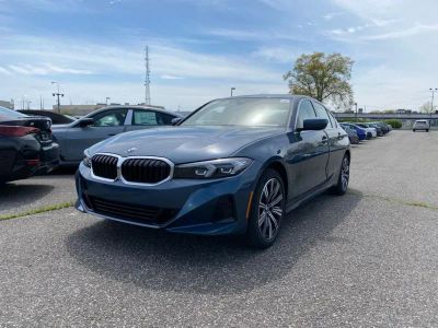 2026 BMW 3 Series 330i xDrive in Arctic Race Blue metallic — front three-quarter view