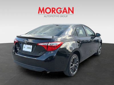 2015 Toyota Corolla — rear three-quarter view