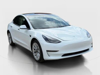 2023 Tesla Model 3 — rear three-quarter view