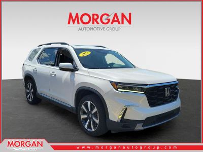 2025 Honda Pilot Touring+ in Platinum White — front three-quarter view