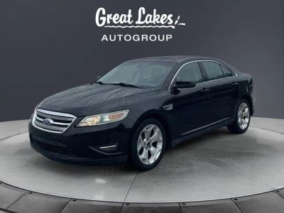 2011 Ford Taurus SEL in Ebony Black — front three-quarter view