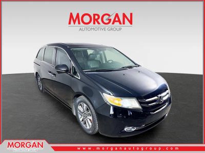 2015 Honda Odyssey Touring in Black — front three-quarter view