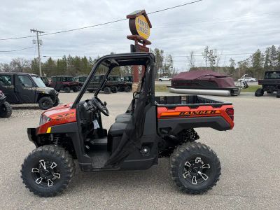 2026 Polaris Ranger XP 1000 Premium R26RRE99AF in Orange Rust — front three-quarter view