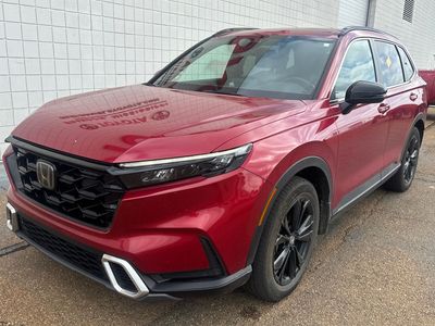 2023 Honda CR-V Hybrid Sport Touring in Radiant Red Metallic — front three-quarter view