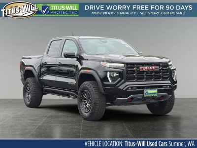 2024 GMC Canyon AT4X in Onyx Black — front three-quarter view