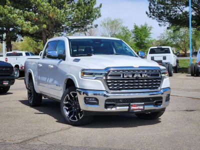 2026 RAM 1500 RAM 1500 LIMITED LONGHORN CREW CAB 4X4 5'7' BOX in Ivory White Tri-Coat Pearlcoat — front three-quarter view