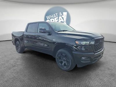 2026 RAM 1500 Big Horn/Lone Star in Diamond Black Crystal Pearlcoat — front three-quarter view