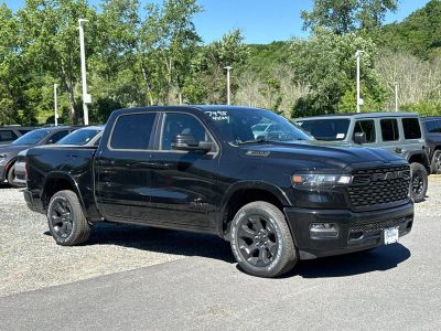 2026 RAM 1500 Big Horn in Diamond Black Crystal Pearlcoat — front three-quarter view
