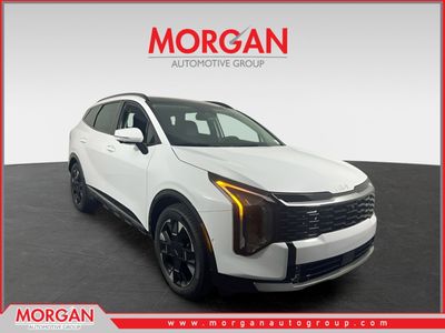 2026 Kia Sportage SX-Prestige in Glacial White Pearl — front three-quarter view
