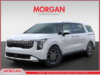 2026 Kia Carnival Hybrid EX in Snow White Pearl — front three-quarter view