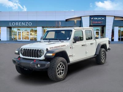 2025 Jeep Gladiator Rubicon in Bright White Clearcoat — front three-quarter view