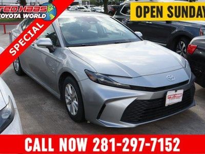 2025 Toyota Camry LE in Silver — front three-quarter view