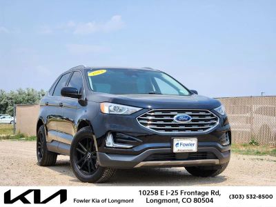 2021 Ford Edge SEL in Black Metallic — front three-quarter view