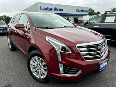 2018 Cadillac XT5 AWD in Red Passion Tintcoat — front three-quarter view