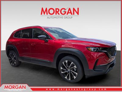 2026 Mazda CX-50 Hybrid Premium Plus in Red — front three-quarter view